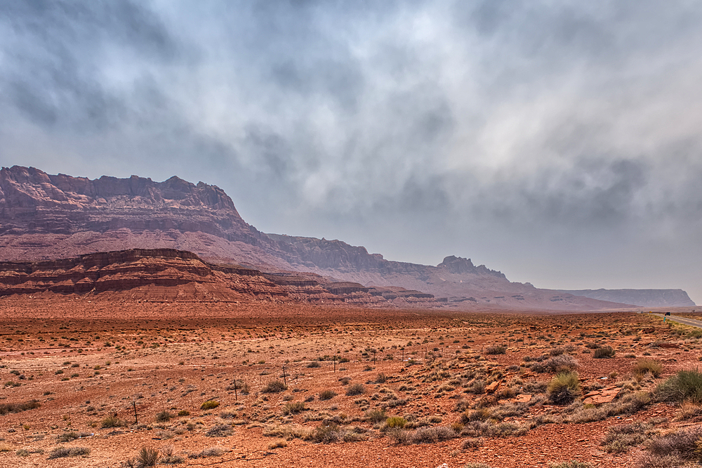 Echo Cliffs near Marble Canyon Arizona enshrouded with smoke from the Dragon Bravo Wildfire burning on Grand Canyon North Rim.