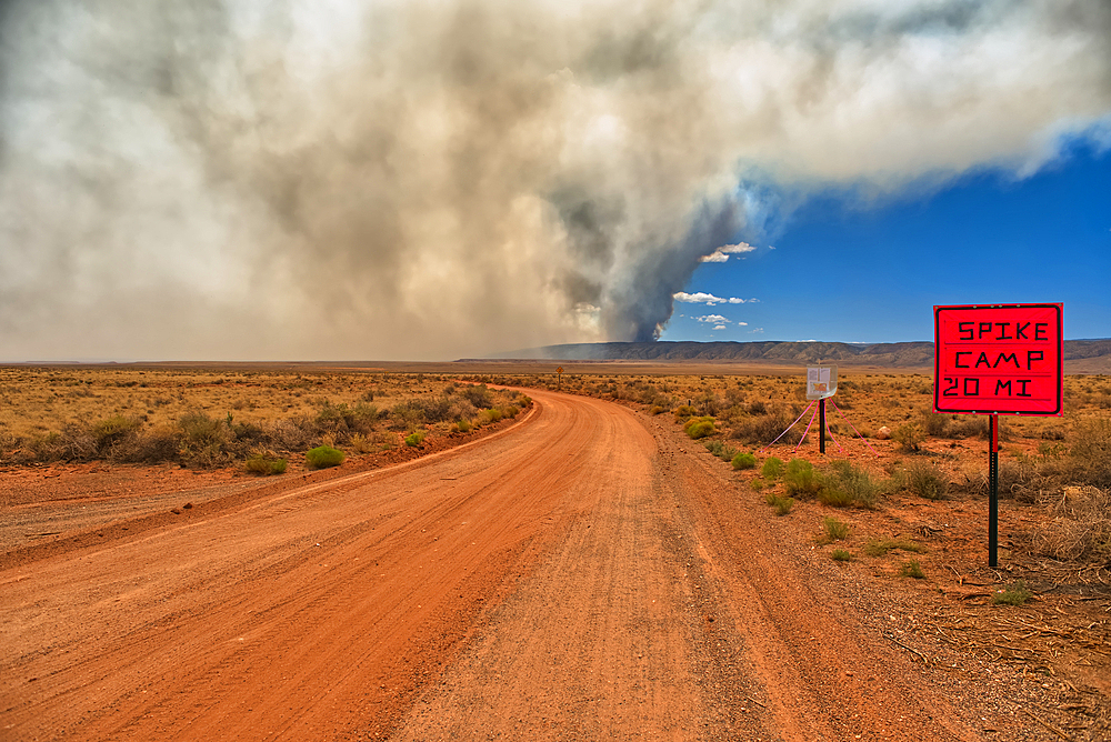 Smoke from the Dragon Bravo Wildfire burning on Grand Canyon North Rim billowing off the Kaibab Plateau. Viewed from House Rock Road across from Vermilion Cliffs.