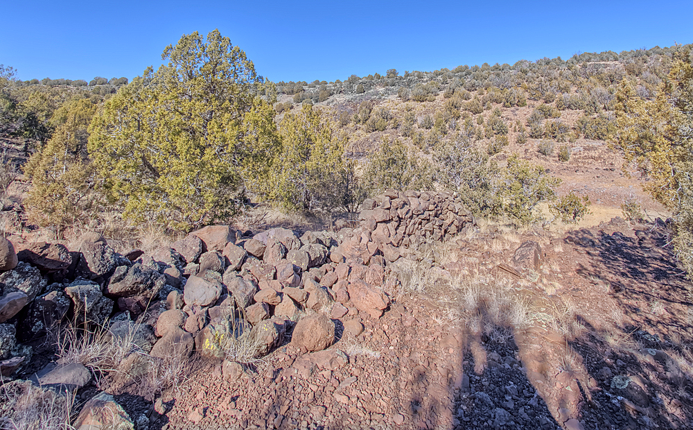 The remains of a rock wall built by ancient Indians along the Stone to Steel Trail that runs between the historic Stone Dam and Bainbridge Steel Dam near Ash Fork Arizona.