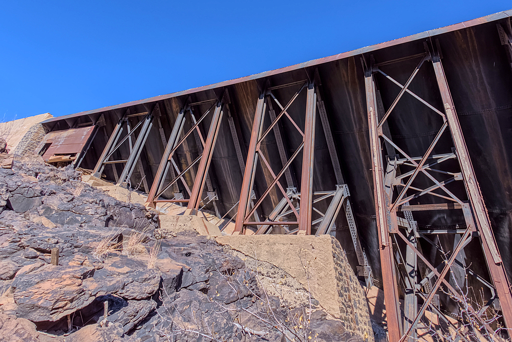 View from below the historic Bainbridge Steel Dam near Ash Fork Arizona in the Kaibab National Forest. It was originally constructed in the late 1800s and is now a historic landmark that is open to the public.