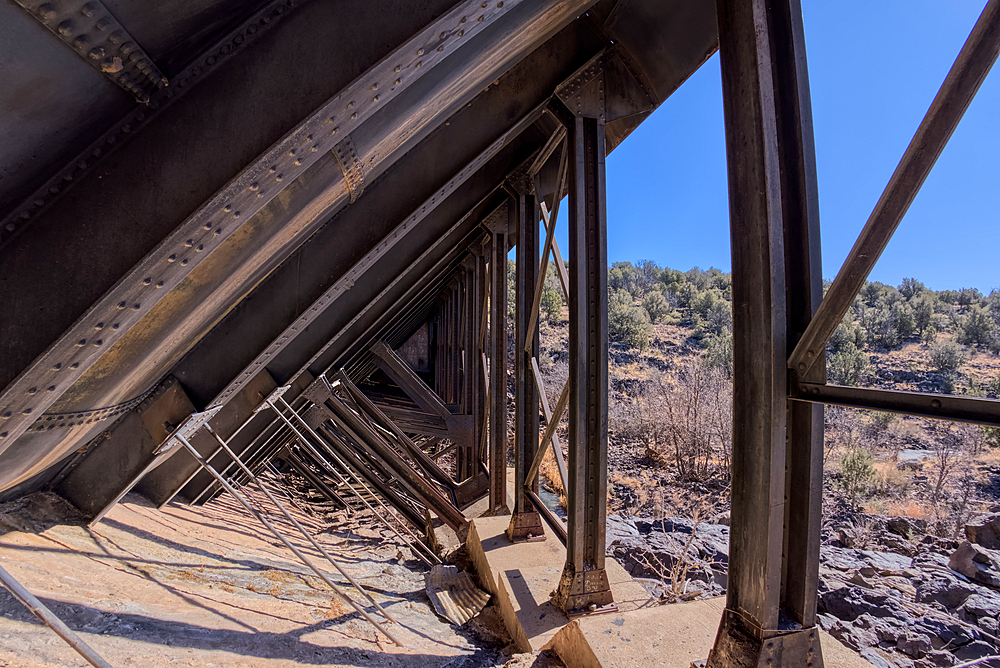 View from inside the steel framework of the historic Bainbridge Steel Dam near Ash Fork Arizona in the Kaibab National Forest. It was originally constructed in the late 1800s and is now a historic landmark that is open to the public.