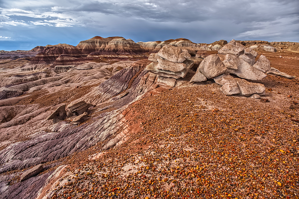 A desolate barren valley of rock and sand in Petrified Forest National Park Arizona just west of Blue Mesa.