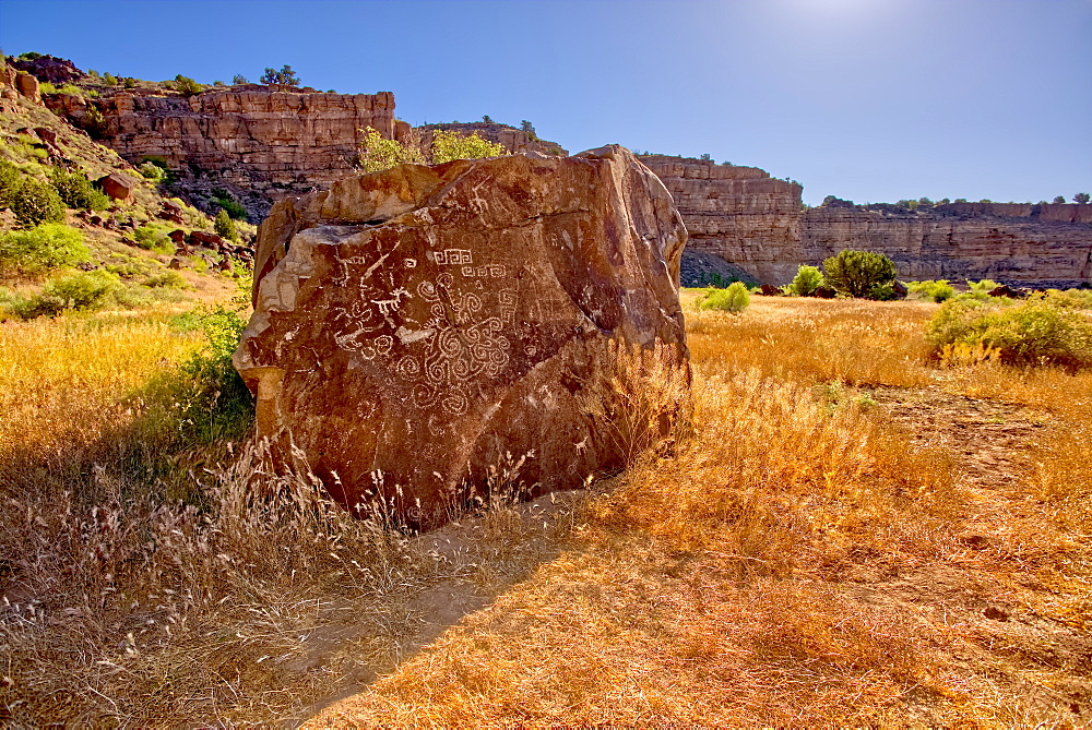 A large petroglyph covered boulder in dry Stillman Lake at the bottom of the Verde River Canyon in Paulden, Arizona, United States of America, North America