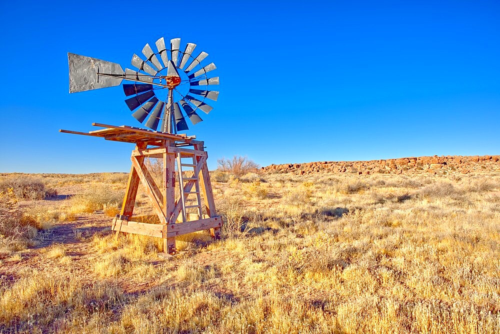 An old windmill marking the boundary of the Devil's Playground in Petrified Forest National Park, Arizona, United States of America, North America