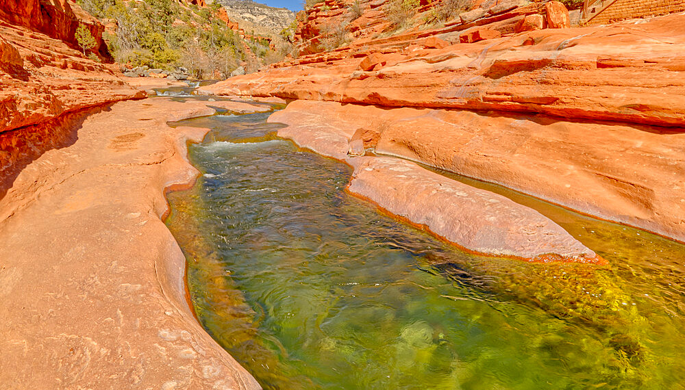 Slick rock water channel in Slide Rock State Park where most swimmers begin their slide in Oak Creek north of Sedona, Arizona, United States of America, North America