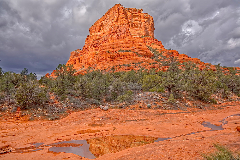 Reflections of Courthouse Butte in water puddles on its east side, located in Sedona, Arizona, United States of America, North America