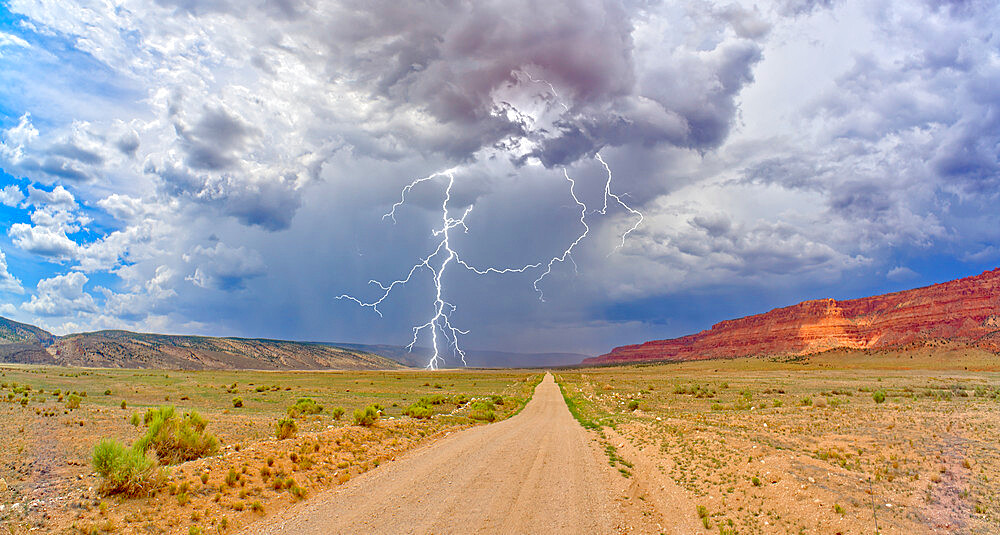 Lightning storm rolling across House Rock Valley Road on the west side of Vermilion Cliffs National Monument, Arizona, United States of America, North America