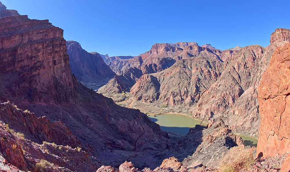 The South Kaibab Trail winding down to the Black Bridge that spans the Colorado River at Grand Canyon Arizona. Phantom Ranch is just left of center.