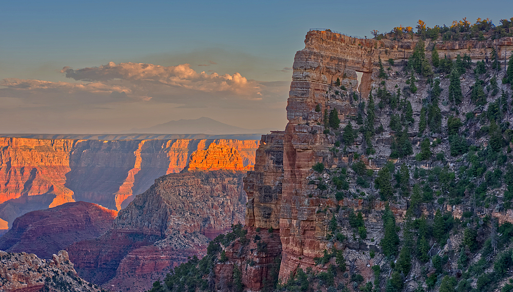 Closeup of Angel's Window at Cape Royal on North Rim above Unker Creek near sundown, with brown haze on the horizon smoke from a wildfire near the park, Grand Canyon National Park, UNESCO World Heritage Site, Arizona, United States of America, North America