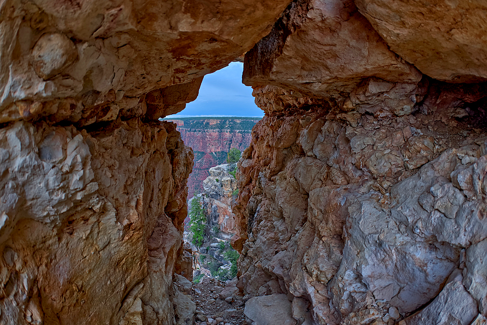 A gap between a stack of balanced boulders on a cliff east of Grandview Point at Grand Canyon South Rim, Grand Canyon National Park, UNESCO World Heritage Site, Arizona, United States of America, North America