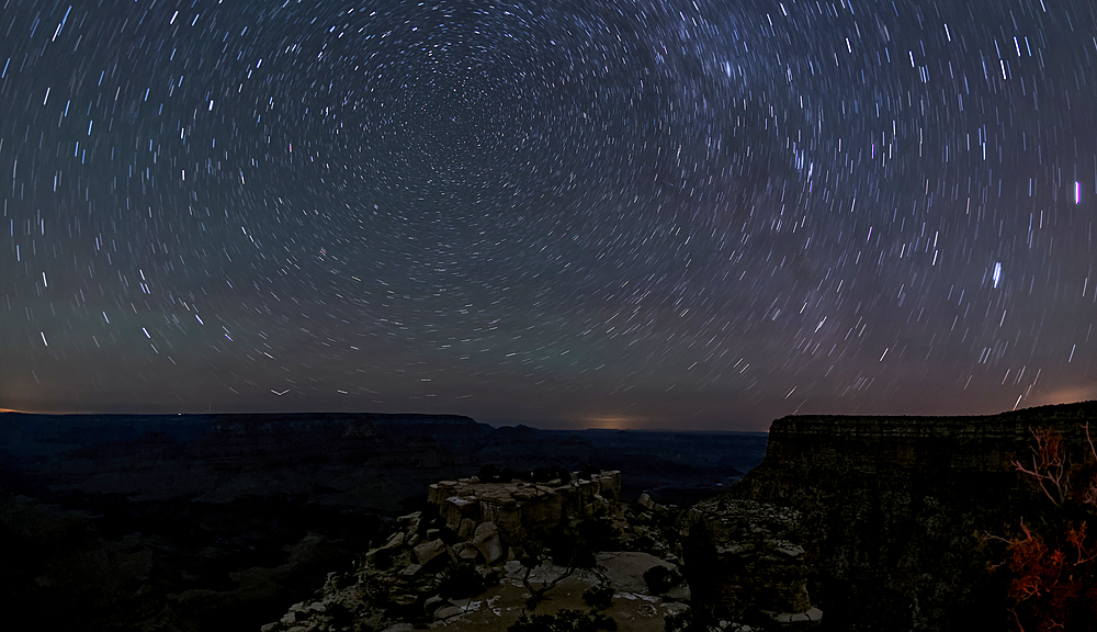 The swirl of stars in the night sky over Grand Canyon South Rim viewed from Moran Point, Grand Canyon National Park, UNESCO World Heritage Site, Arizona, United States of America, North America