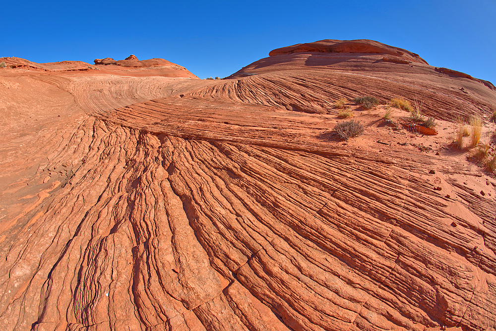 View from the top of a wavy sandstone mesa, a fossilized sand dune, at Ferry Swale in the Glen Canyon Recreation Area near Page, Arizona, United States of America, North America