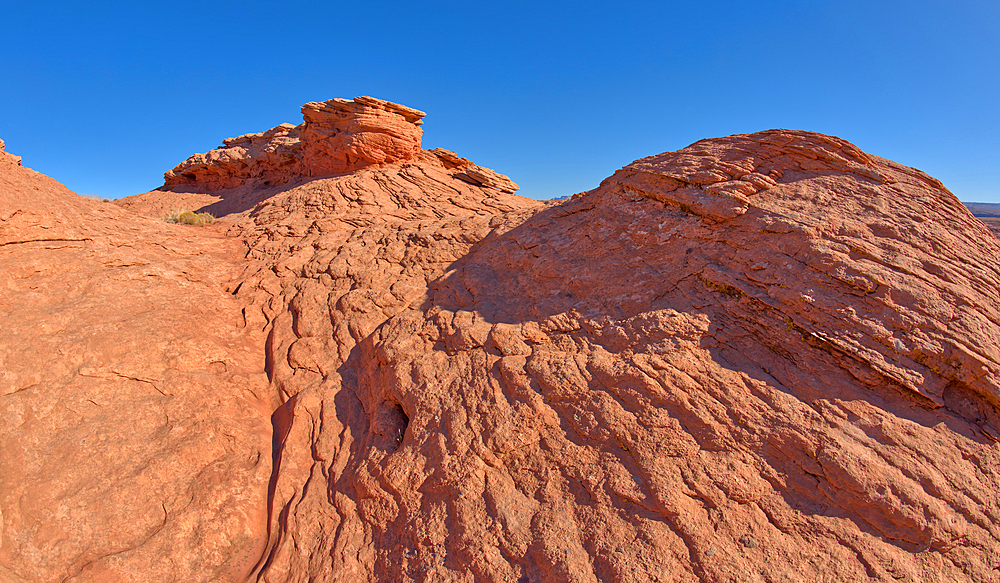 A wavy sandstone hill, a fossilized sand dune, at Ferry Swale in the Glen Canyon Recreation Area near Page, Arizona, United States of America, North America