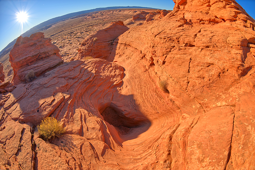 A dry waterfall at the base of a rock island at Ferry Swale in the Glen Canyon Recreation Area near Page, Arizona, United States of America, North America