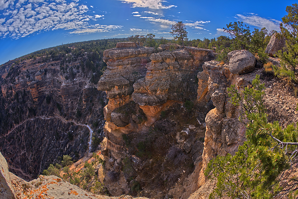 An outcrop of rock overlooking the Bright Angel Trail below at Grand Canyon South Rim off Hermit Road, Grand Canyon, UNESCO World Heritage Site, Arizona, United States of America, North America