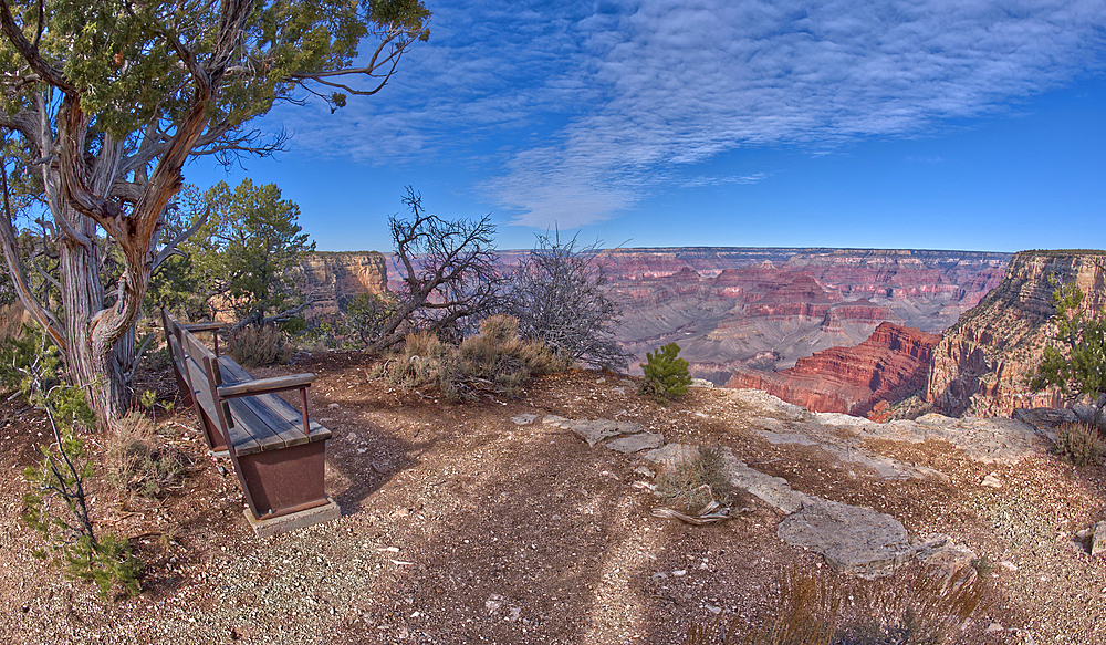 A bench along the rim trail overlooking Grand Canyon South Rim off Hermit Road halfway between Monument Creek Vista and The Abyss, Grand Canyon, Arizona, United States of America, North America