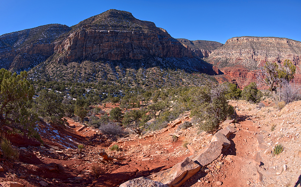 The very rocky pathway of the unmaintained Hermit Canyon Trail at Grand Canyonin winter with Waldron Canyon on the left in the distance, Grand Canyon, Arizona, United States of America, North America