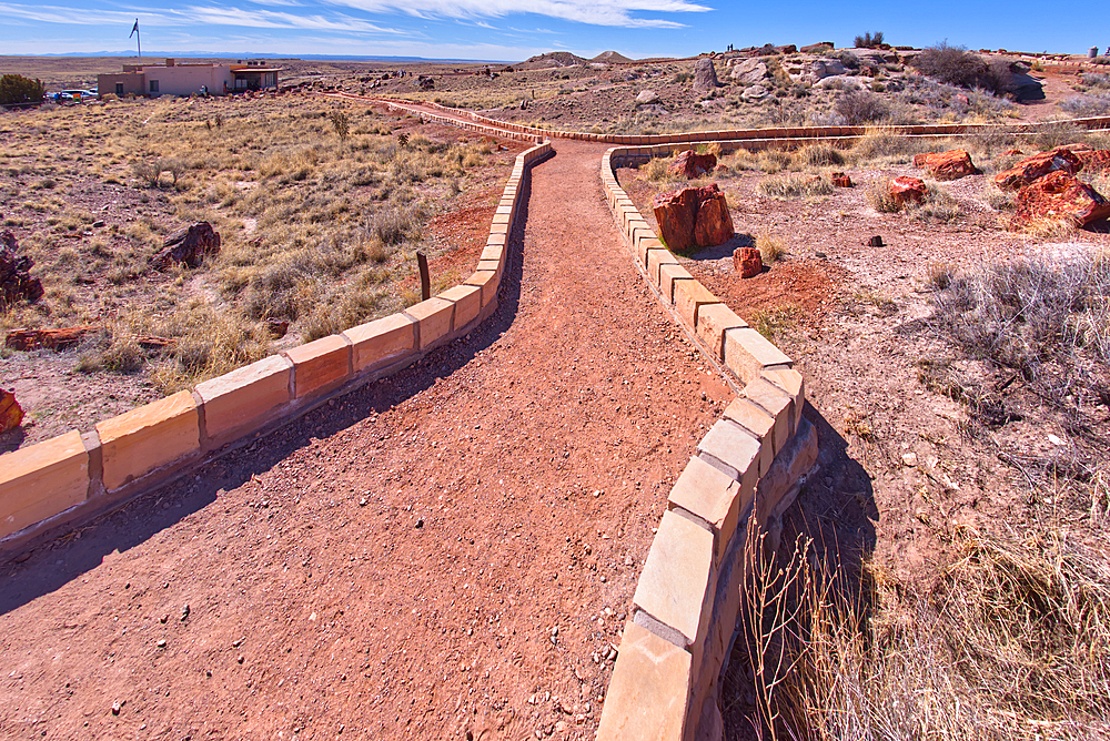 A divide in the trail loop for the Giant Logs trail at Petrified Forest National Park with the Rainbow Forest Museum on upper left, Arizona, United States of America, North America