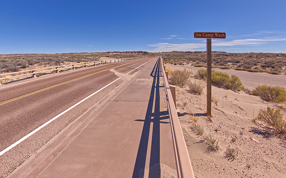 Sign along the path to the Long Logs Trail, marking the Jim Camp Wash along the main road of Petrified Forest National Park, Arizona, United States of America, North America