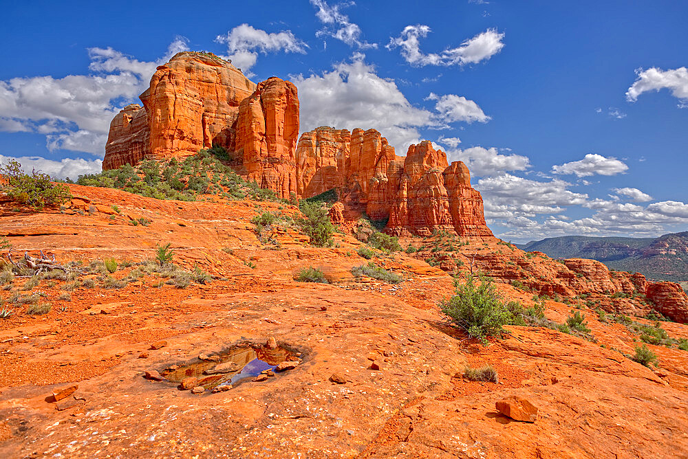 A reflection of Cathedral Rock in a shallow pool of water on the northwest slope, Sedona, Arizona, United States of America, North America