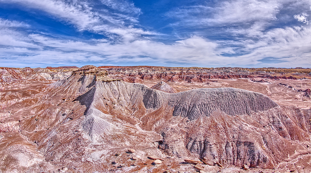 A ridge of gray bentonite viewed from a nearby flat top mesa on the south end of Petrified Forest National Park, Arizona, United States of America, North America