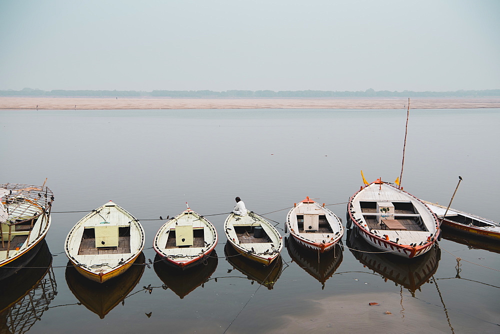 Moored boats line the ghats of the Ganges, Varanasi, Uttar Pradesh, India, Asia