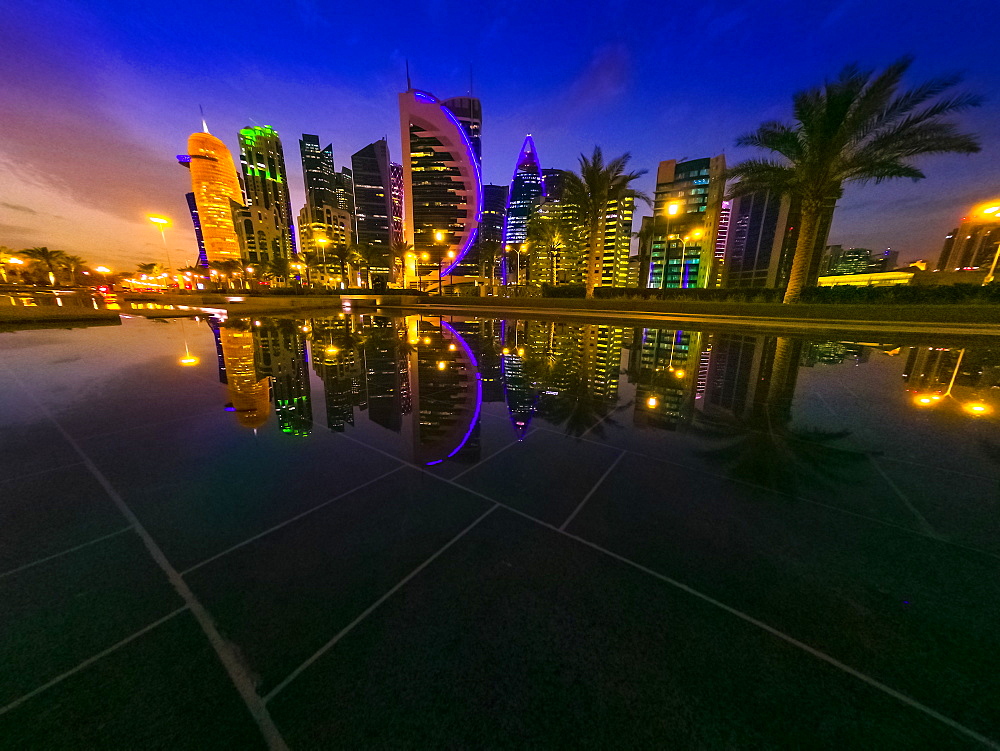 Illuminated cityscape skyline, West Bay skyline in the evening and reflections, Doha, Qatar, Middle East