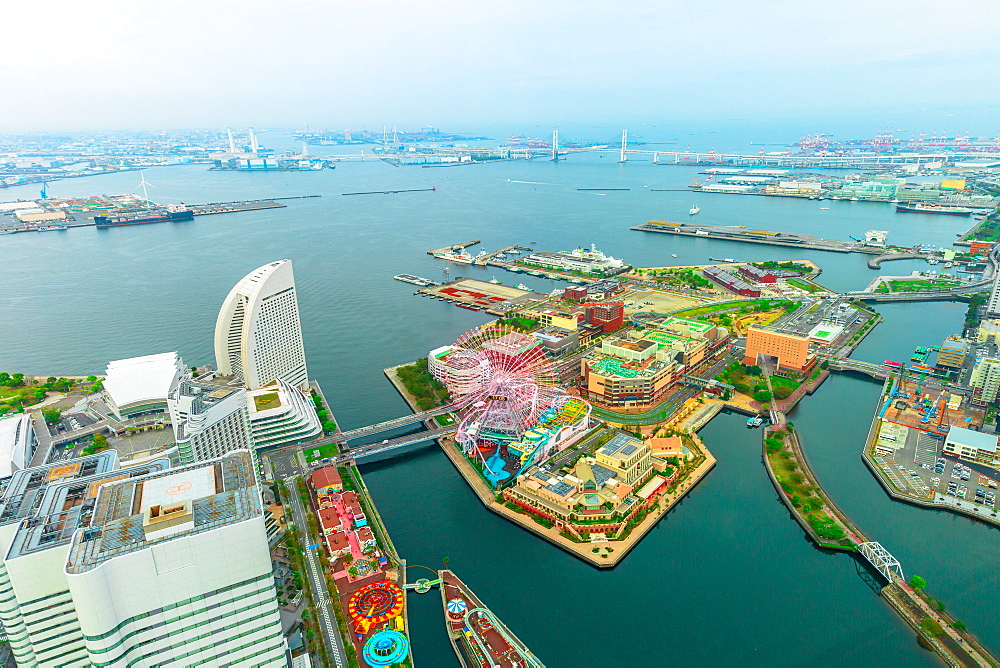 Aerial view of Yokohama Cityscape and skyline at Minato Mirai waterfront district over the port at twilight from viewing platform of Landmark Tower, skyscrapers from observatory sky garden, Yokohama, Honshu, Japan, Asia