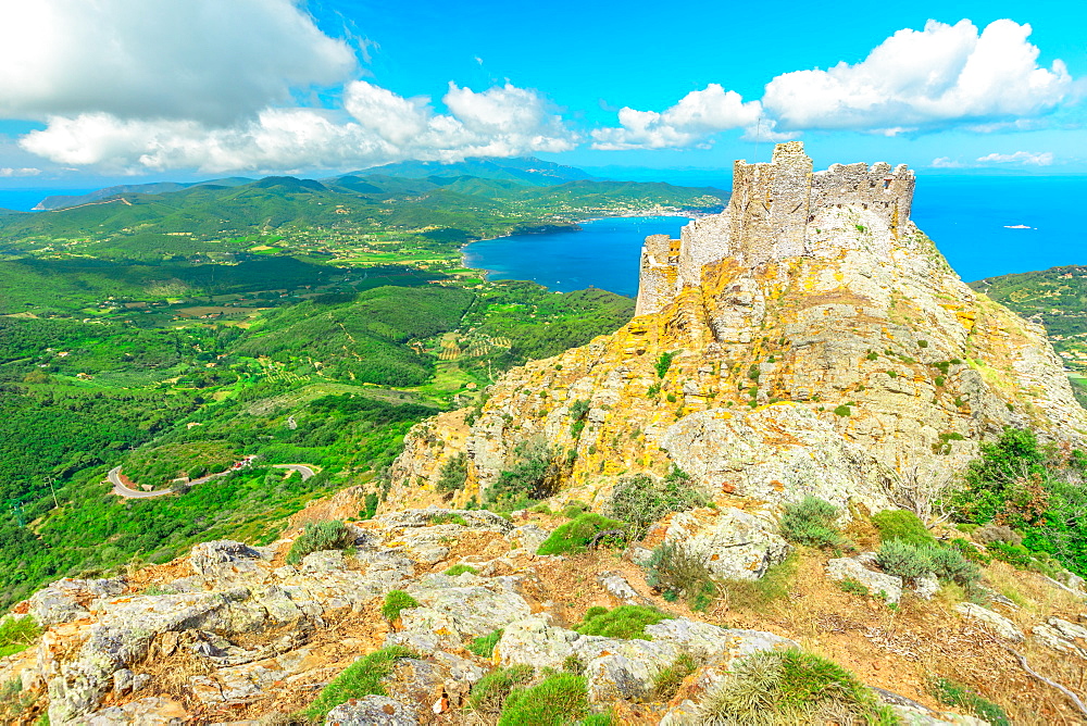 Iconic view from top of Elba mountain of Volterraio Castle on rock at 394 m, Fortress of Volterraio, symbol of Elba Island, dominates Portoferraio Gulf, Tuscan Archipelago, Tuscany, Italy, Europe