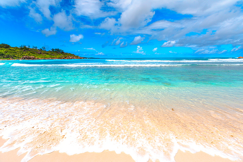 White sandy beach and turquoise clear sea of Anse Cocos, La Digue, Seychelles, Indian Ocean, Africa