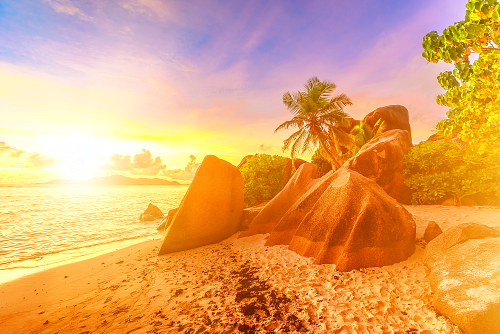 Rocks on beach and palm trees, Anse Source d'Argent at sunset, La Digue, Seychelles, Indian Ocean, Africa