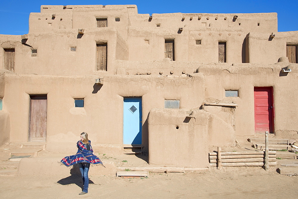 Woman visitor at Taos Pueblo, UNESCO World Heritage Site, Taos, New Mexico, United States of America, North America