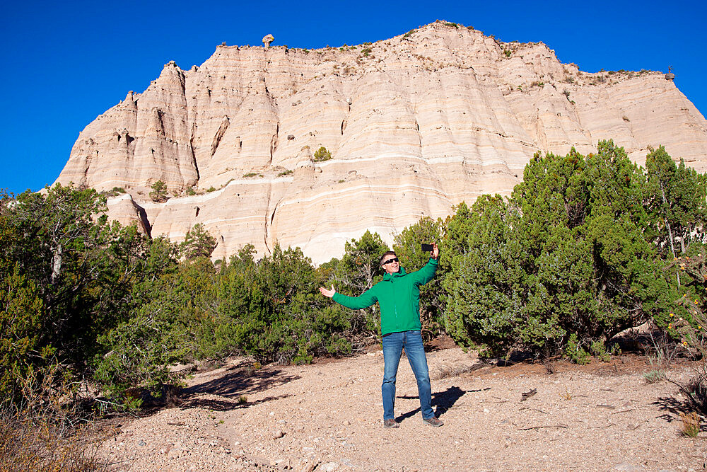 Man posing for a selfie in front of Kasha-Katuwe Tent Rocks National Monument, New Mexico, United States of America, North America