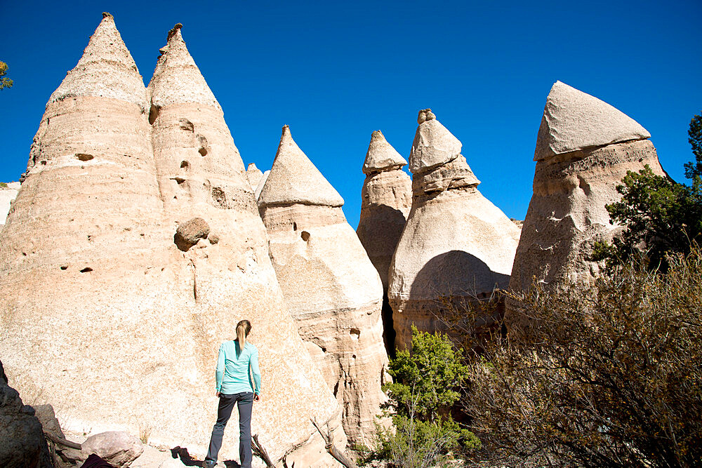 Woman admiring sandstone towers in Kasha-Katuwe Tent Rocks National Monument, New Mexico, United States of America, North America