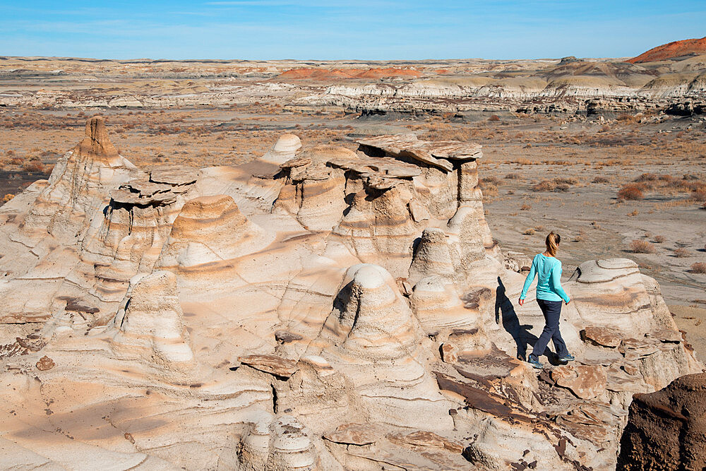 Hiking around hoodoo sandstone formations in Bisti/De-Na-Zin Wilderness, New Mexico, United States of America, North America