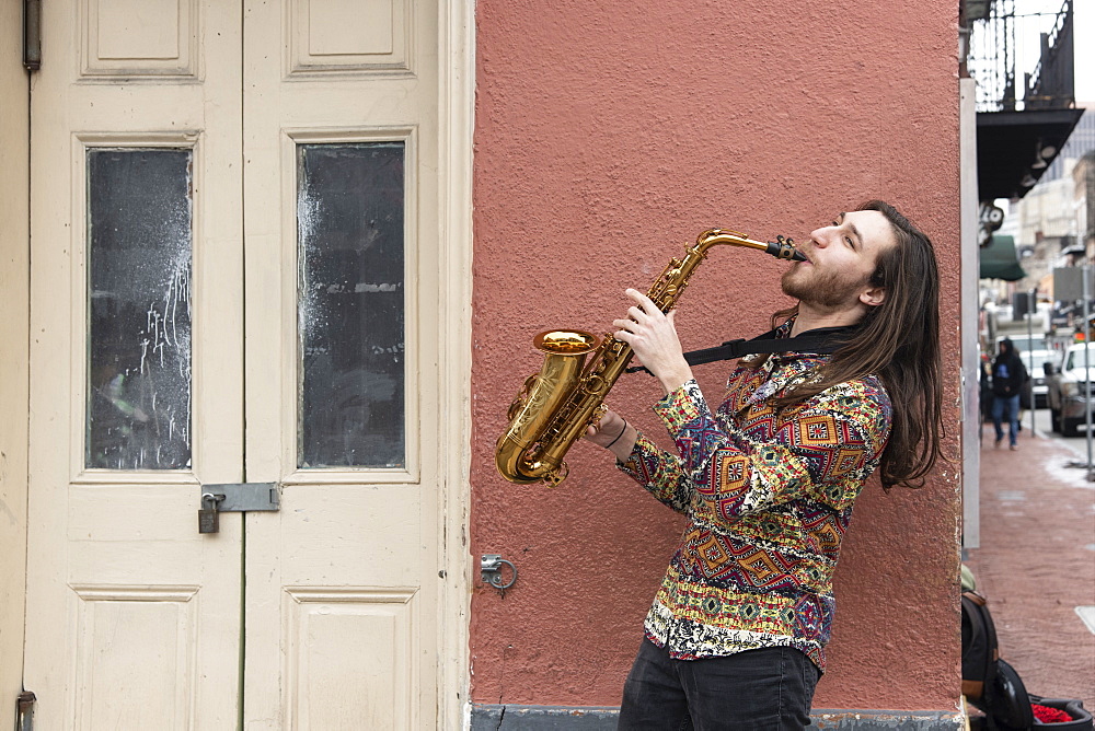 Saxophone player on a Bourbon Street corner in the French Quarter of New Orleans, Louisiana, United States of America, North America