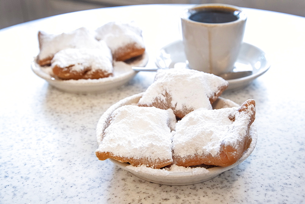 Famous food of New Orleans: beignets and chicory coffee at Cafe Du Monde, New Orleans, Louisiana, United States of America, North America