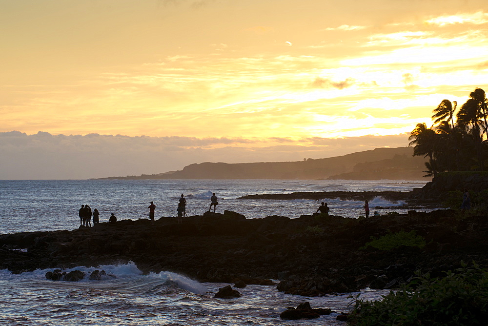 Watching the sunset along the southern coast of Kauai, Hawaii, United States of America, North America