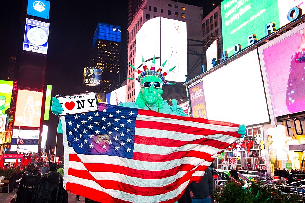 Statue of Liberty impersonators posing with tourists for tips at Times Square, Manhattan, New York City, New York, United States of America, North America