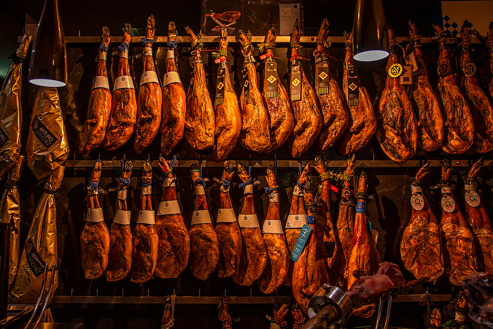 Ham legs for sale in a shop in Seville, Andalusia, Spain, Europe