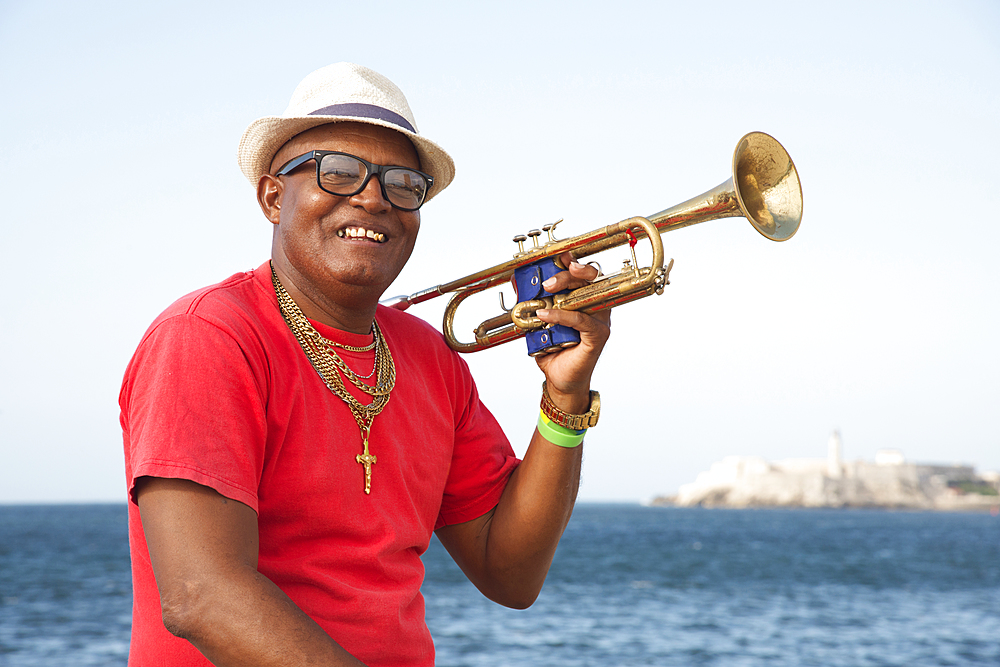 Trumpet player along the Malecon in Havana, Cuba, West Indies, Caribbean, Central America