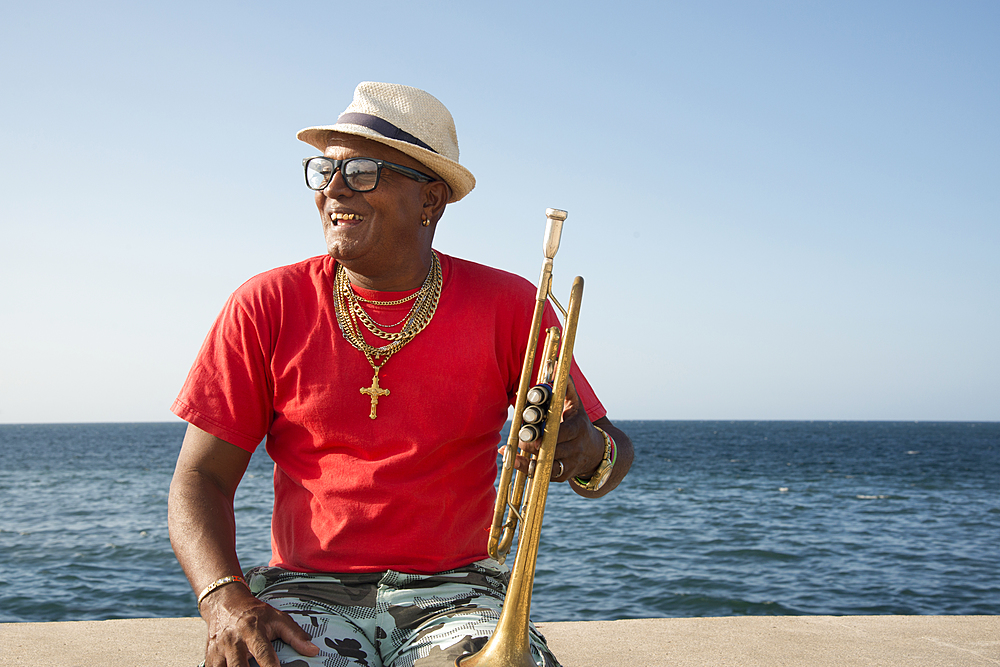 Trumpet player along the Malecon in Havana, Cuba, West Indies, Caribbean, Central America