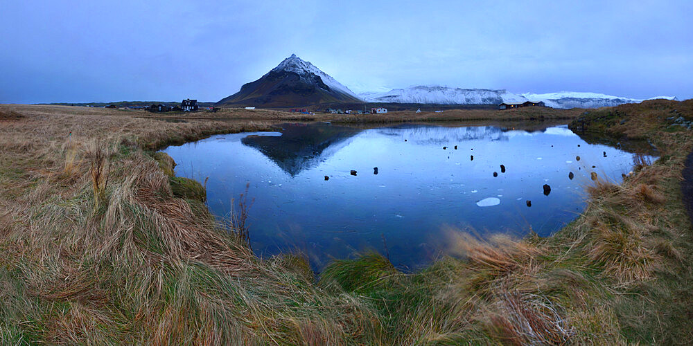 Reflection of ancient volcano on pond, Iceland, Polar Regions