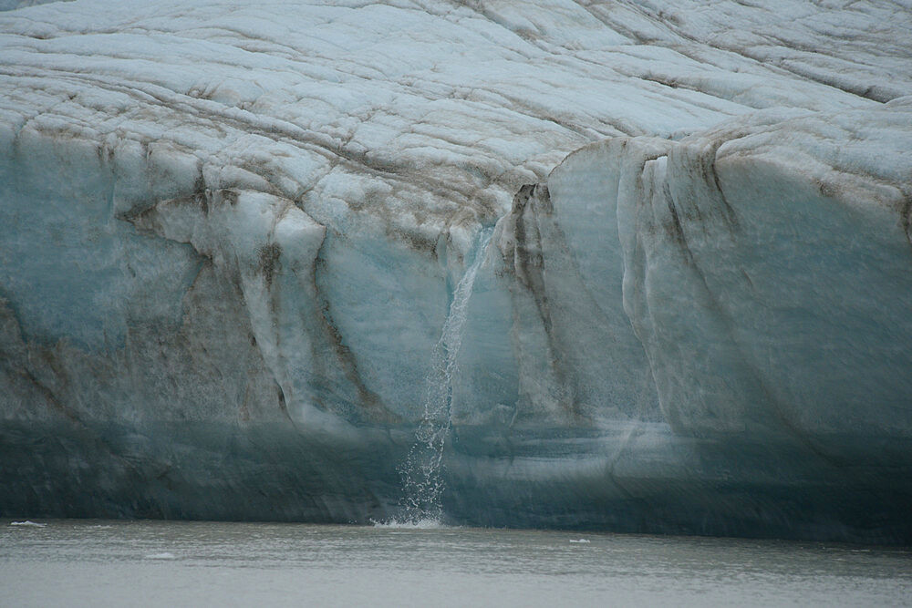 Melt water flowing from glacier face, Nunavut and Northwest Territories, Canada, North America