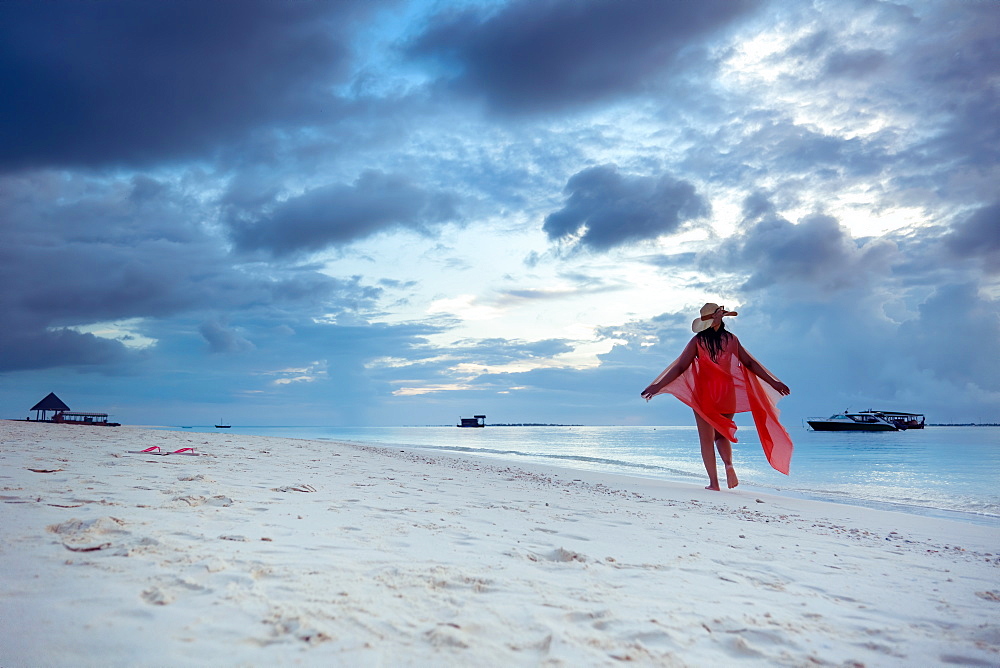 A woman enjoying the beach, The Maldives, Indian Ocean, Asia