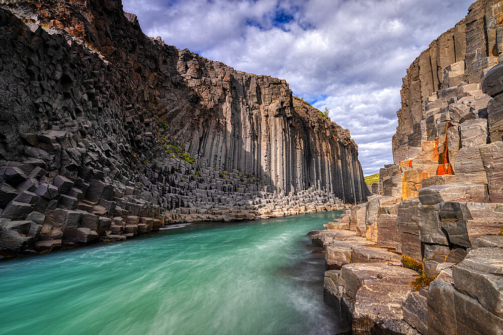 The basalt cliffs of Studlagil Canyon, Iceland, Polar Regions