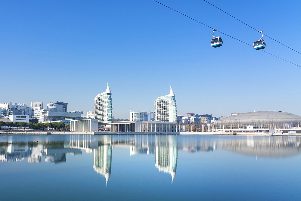 Reflection of Pavilhao de Portugal, Expo 98, with cable car, in Parque das Nacoes (Park of the Nations), Lisbon, Portugal, Europe