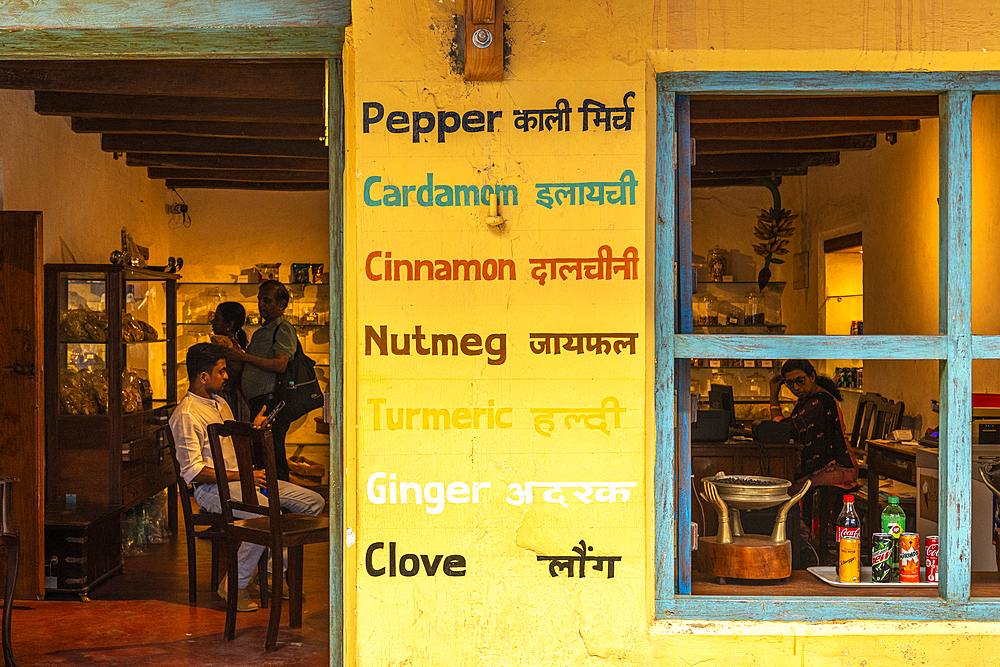 Outside a bright yellow spice shop, Fort Kochi, Kerala, India