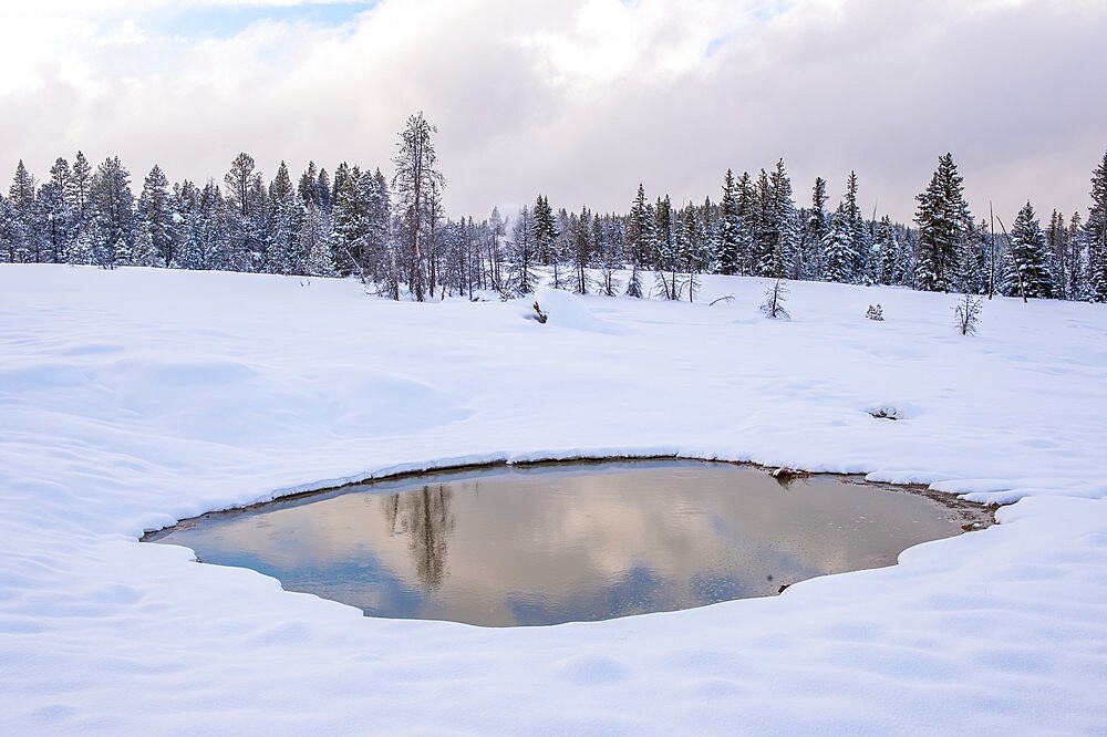 Snowscape of reflection of sky in thermal feature, Yellowstone National Park, UNESCO World Heritage Site, Wyoming, United States of America, North America