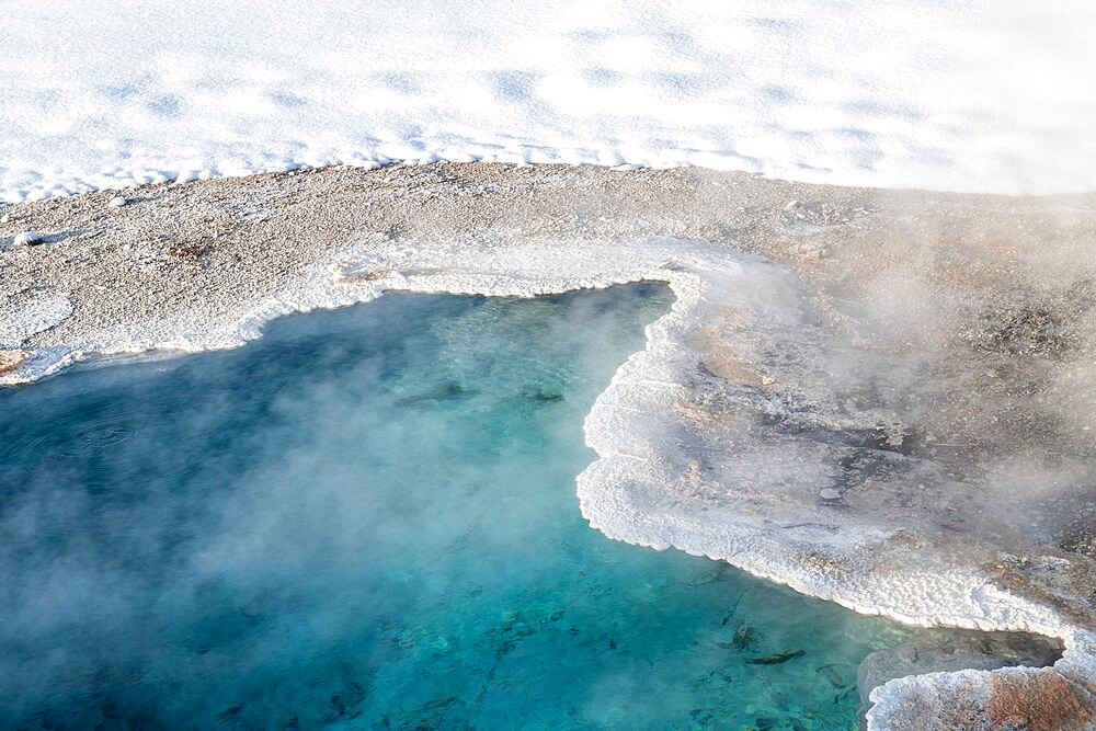 Bright blue thermal feature in snow, Yellowstone National Park, UNESCO World Heritage Site, Wyoming, United States of America, North America